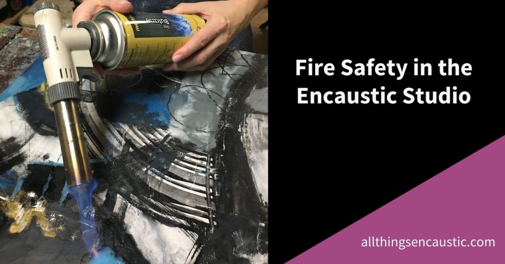 Fire Safety in the Encaustic Studio - Hands using a butane torch to fuse a painting